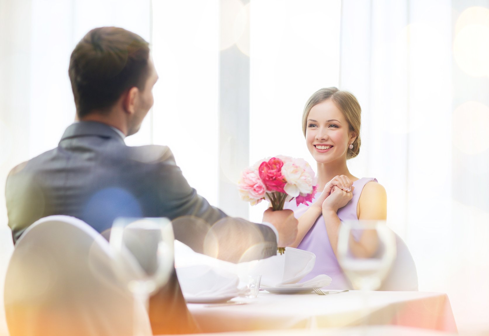 Smiling Woman Recieving Bouquet of Flowers